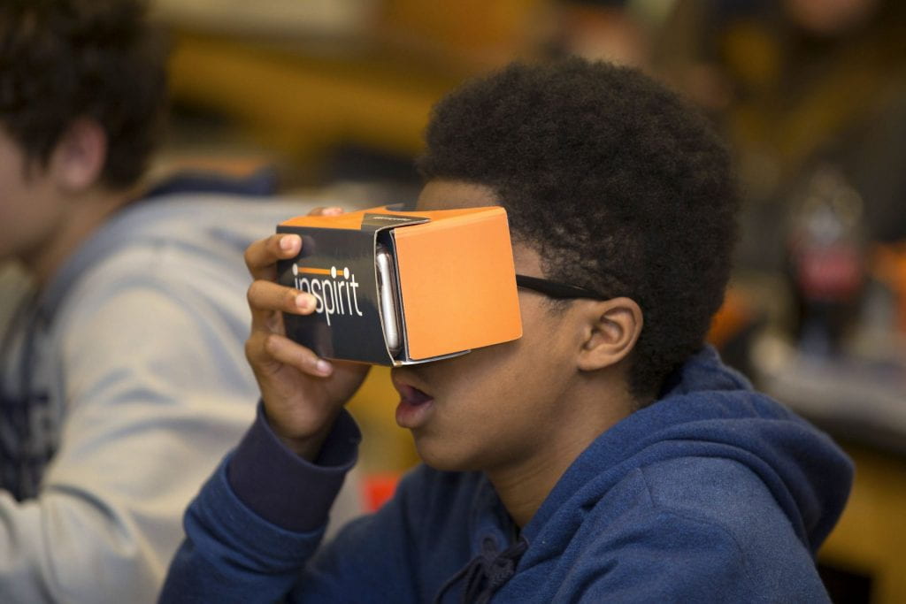 A high school student uses a VR viewer to "go inside" a plant cell as part of an AP Biology class in Cobb County, Georgia.